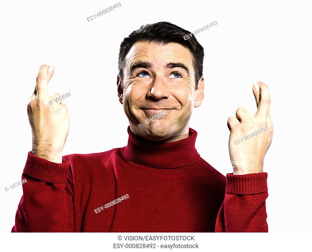 caucasian man finger crossed gesture studio portrait on isolated white backgound