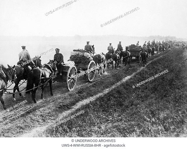 Russia: c. 1915 A wagon train of Russian ammunition caissons on their way to the front. Many of the cases are marked Use Freely