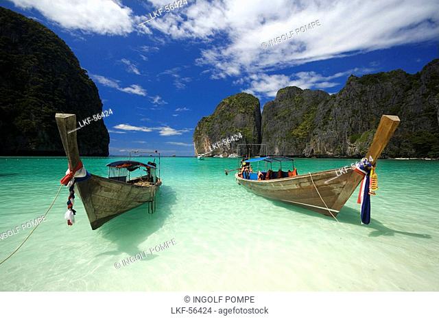 Two boats anchoring in the Maya Bay, a beautiful scenic lagoon, famous for the Hollywood film The Beach, Ko Phi-Phi Leh, Ko Phi-Phi Islands, Krabi, Thailand