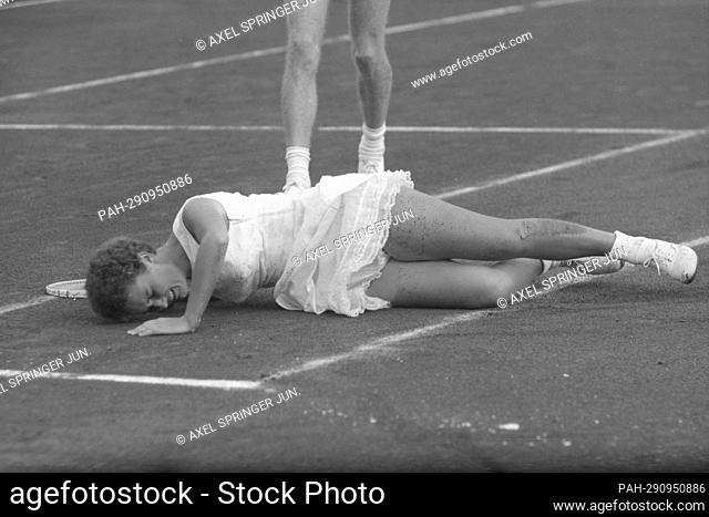 Lesley TURNER BOWREY, Australia, tennis player, is injured after a fall on the clay court, here in the mixed final of the International Tennis Championships of...