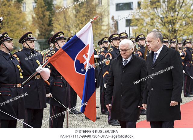 HANDOUT - Handout picture made available on 17 November 2017 showing German President Frank-Walter Steinmeier (C) being received with military honours by Andrej...