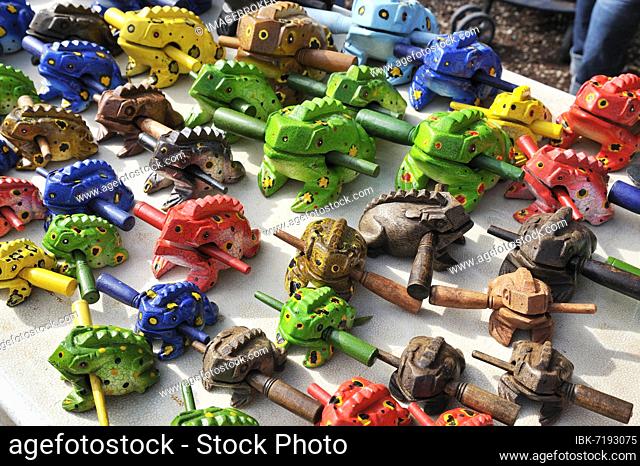 Souvenir sale, wooden frogs, at Lake Arenal, West End, Alajuela Province, Costa Rica, Central America