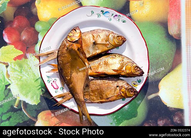 Freshly bloated fishes put in vessel. Food for gourmet