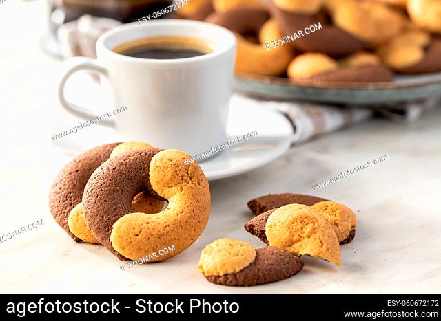 Sweet round biscuits. Cookies with double flavor on kitchen table