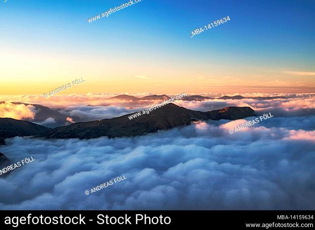 mountains over sea of clouds at sunset. view to the fellhorn. allgäu alps. bavaria, germany, europe