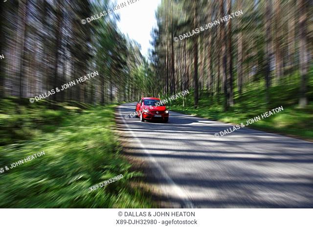 Finland, Region of Southern Savonia, Savonlinna, Punkaharju Ridge, Punkaharju Nature Reserve, Saimaa Lake District, Highway and Vehicle