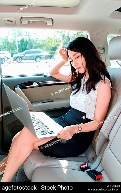 Inside the car tired business women