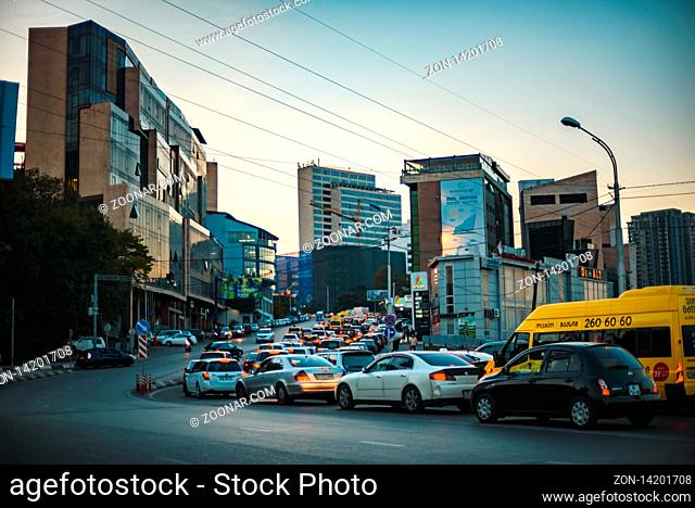 Tbilisi, Georgia - October 15, 2018: View of evening Tbilisi buildings and road with cars