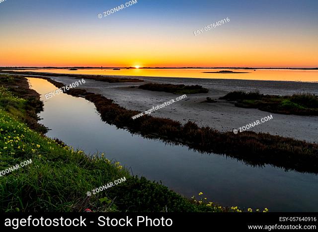 Beautiful nightfall with a colorful sky over wetlands and canals nature landscape
