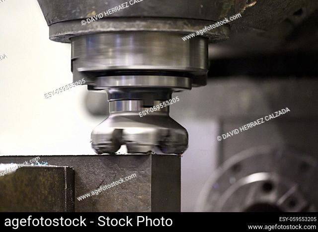 Metalworking. Universal vertical milling machine mills metal