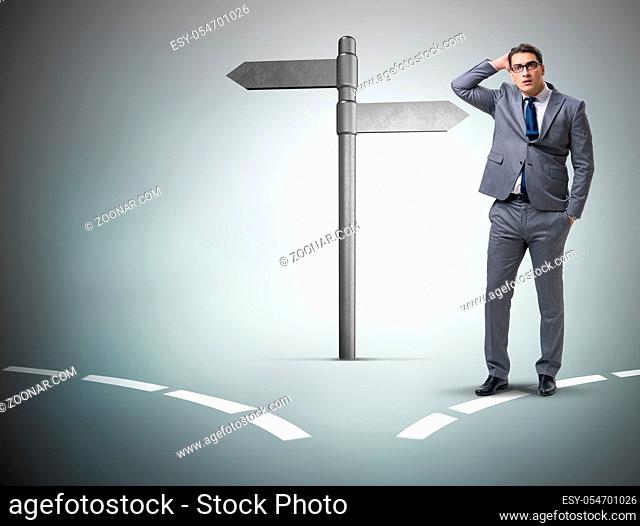 The businessman in difficult choice concept
