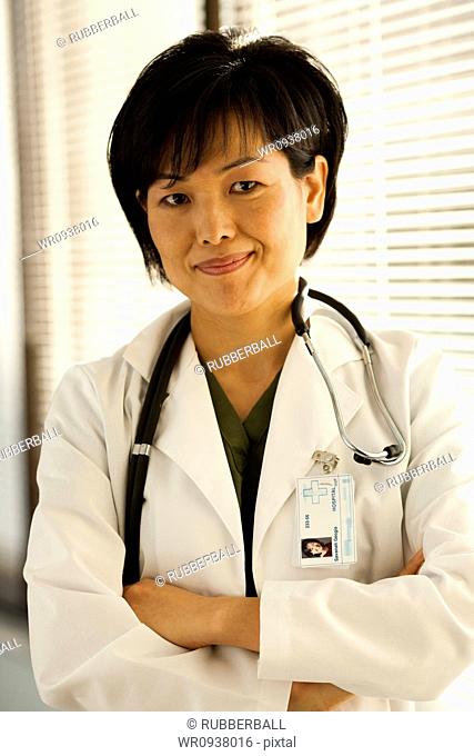 Female doctor smiling with arms crossed