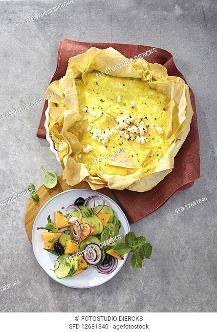Filo pastry quiche with feta cheese served with a cucumber and melon salad
