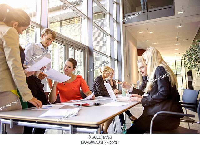 Businessmen and businesswomen at brainstorming meeting