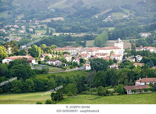 Farm fields in front of Sare, France in Basque Country on Spanish-French border, a hilltop 17th century village in the Labourd province