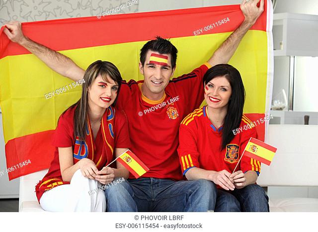 Thee excited Spanish soccer fans