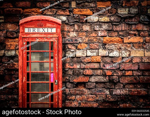 Image Representing Broken Brexit Britain Of An Old Peeling Red Telephone Box Against A Grungy Red Brick Wall With Copy Space