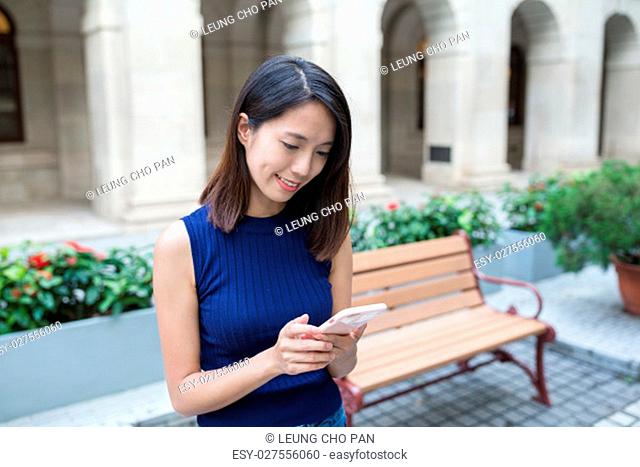 Woman using smart phone at outdoor