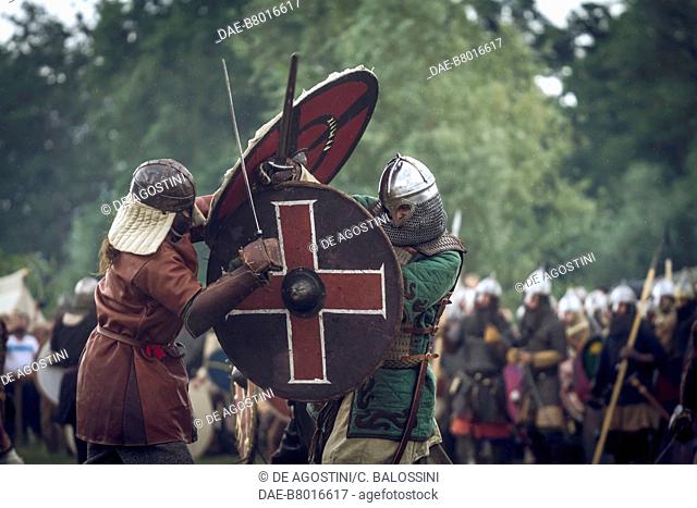 Warriors in battle with swords and shields, Slavic and Viking Festival, Centre of Slavs and Vikings, Jomsborg-Vineta, Wolin island, Poland