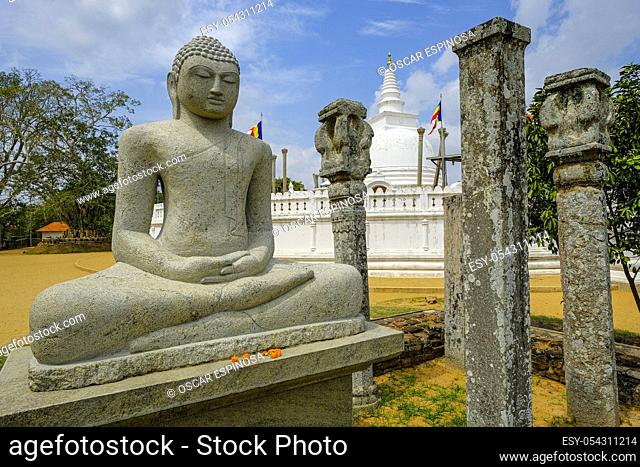 Anuradhapura, Sri Lanka - February 2020: Buddha statue in the Buddhist stupa Thuparama Dagoba on February 6, 2020 in Anuradhapura, Sri Lanka