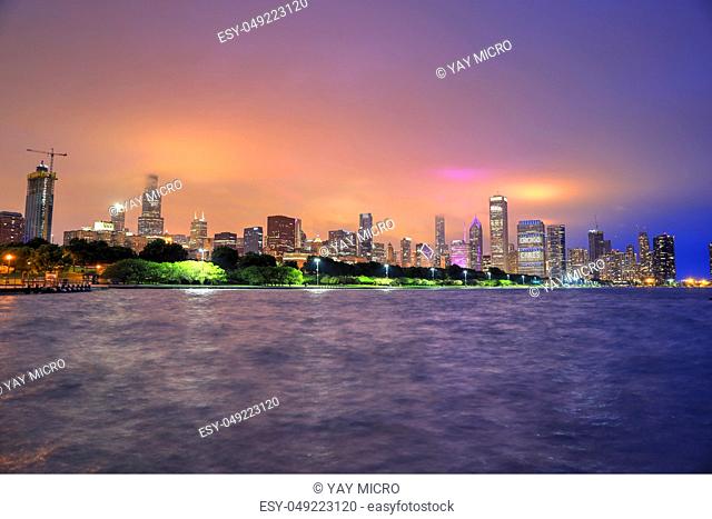 Chicago, Illinois, USA - June 22, 2018 - The Chicago skyline at night after a storm across Lake Michigan