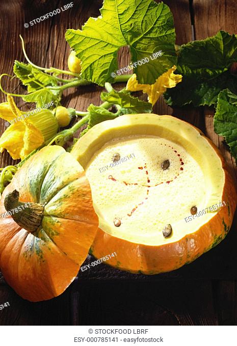 Pumpkin soup served in a hollowed-out pumpkin