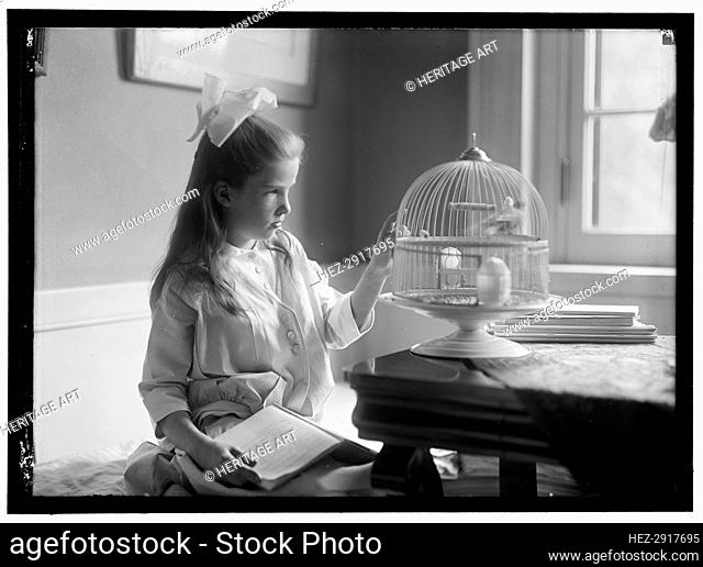 Child with birdcage, between 1910 and 1917. Creator: Harris & Ewing