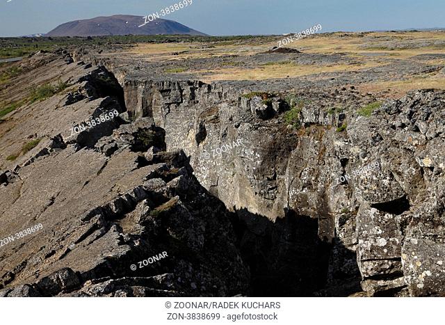 Tectonic crack near Grjótagjá and the Sellandafjall tuya volcanic mountain. Mývatn region, Norðurland eystra North-East Iceland