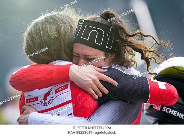 Swiss bobsledders Martina Fontanive (l) and Rahel Rebsamen hug after finishing in 19th place at the Bobsleigh and Skeleton World Championships in Schoenau Am...
