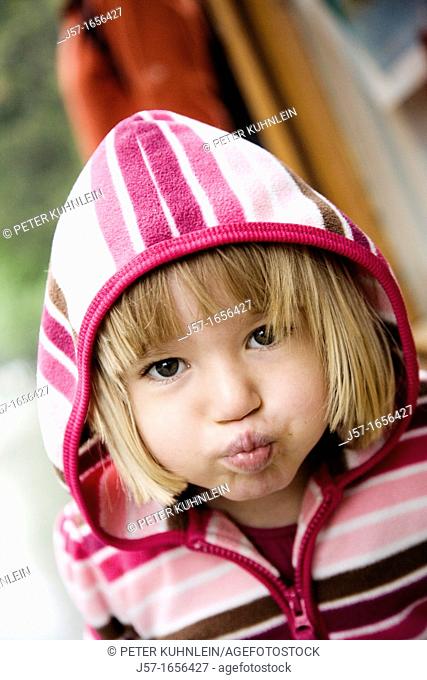 Young girl making a funny face at the camera