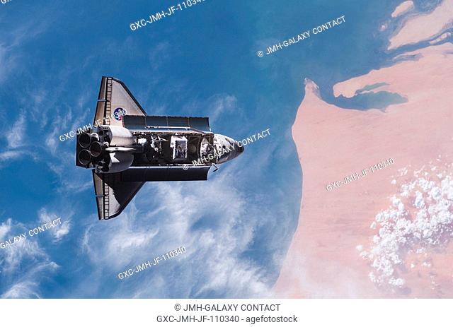 One of a series of photographs of the Space Shuttle Endeavour as it is flown through a slow back flip to allow the crewmembers on the nearby International Space...