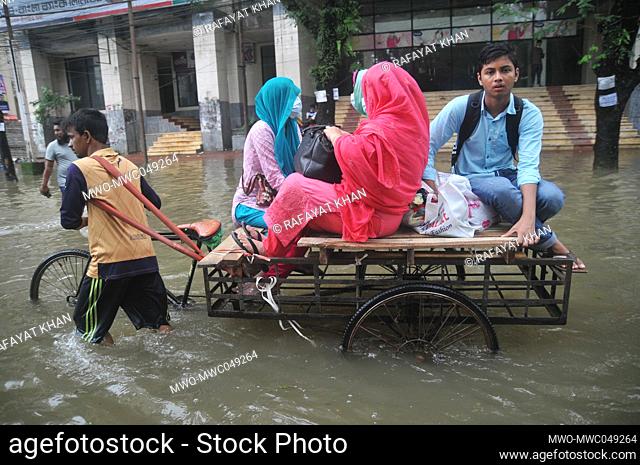 Sylhet, Bangladesh. 20th June 2022. People traveling in rickshaws during floods. The worst flooding in nearly 20 years has ravaged parts of Bangladesh