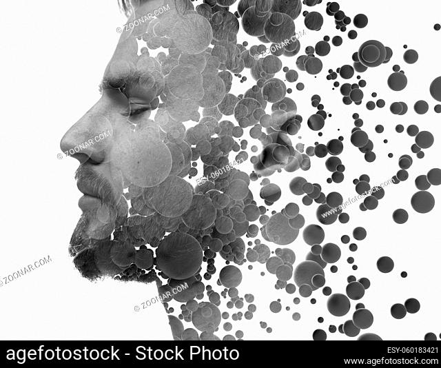 A profile portrait of a man with closed eyes combined with spheres in a double exposure technique. Floating particles