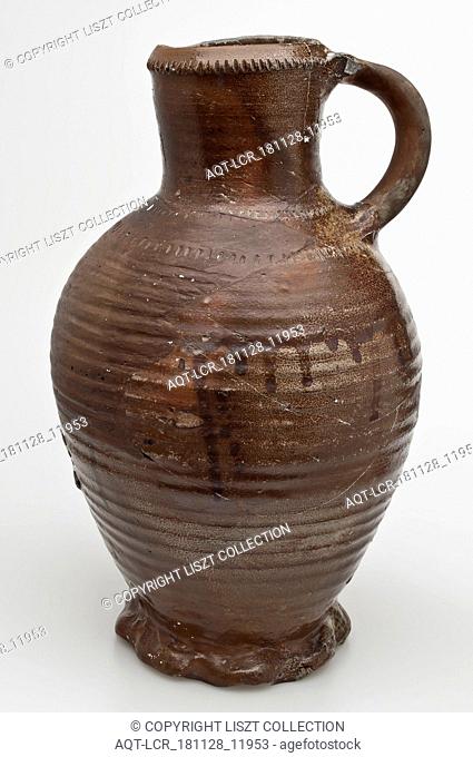 High stoneware jug be used with wheel decoration, standing ear, pinched foot ring, jug be found on the floor ceramic stoneware glaze salt glaze, belly 19