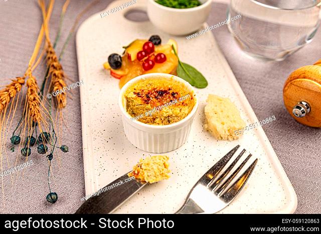 Creme brulee of goose liver pate served on the restaurant table. Gourmet food concept
