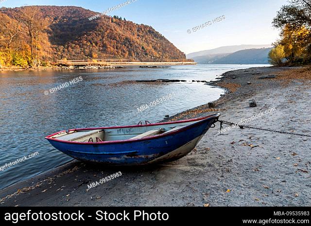 chained rowing boat on the beach of Bacharach, the Middle Rhine, autumn mood, autumn colors, colorful, bright, yellow, UNESCO, world heritage