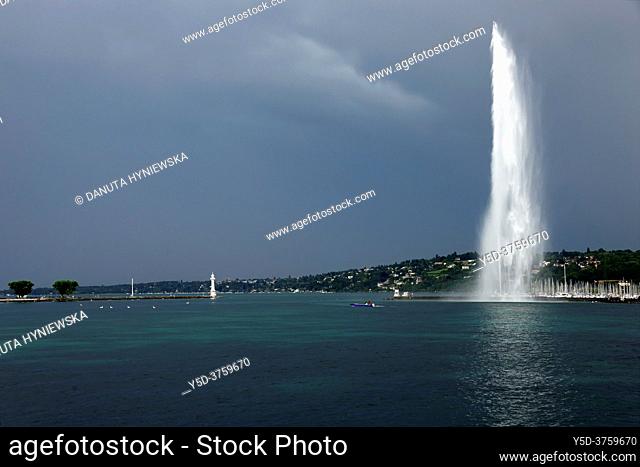 Famous fountain on Geneva Lake 200 meters high, powered by jet engine, on right marina in Geneva, on left very popular Paquis beach, Geneva, Switzerland, Europe