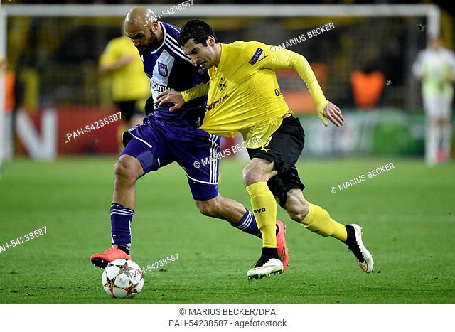 Dortmund's Henrikh Mkhitaryan (R) and Anderlecht's Anthony Vanden Borre vie for the ball during the Champions League Group D football match between...