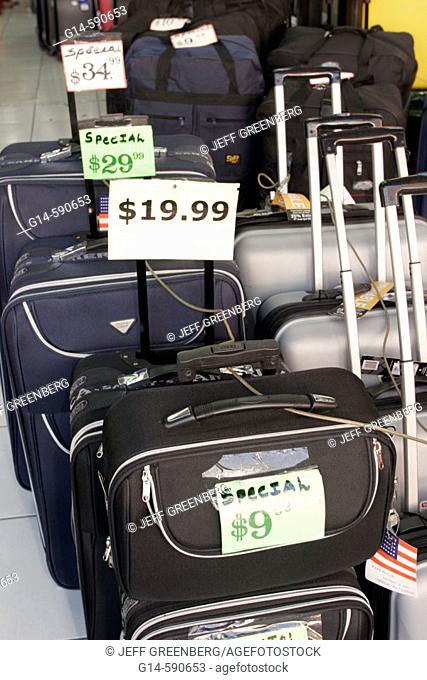Rolling luggage, suitcases for sale. Flagler Street. Miami. Florida. USA
