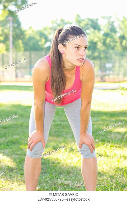 Sporty Fit Healthy Young Woman make a break after running , outdoor activity Healthy Lifestyle