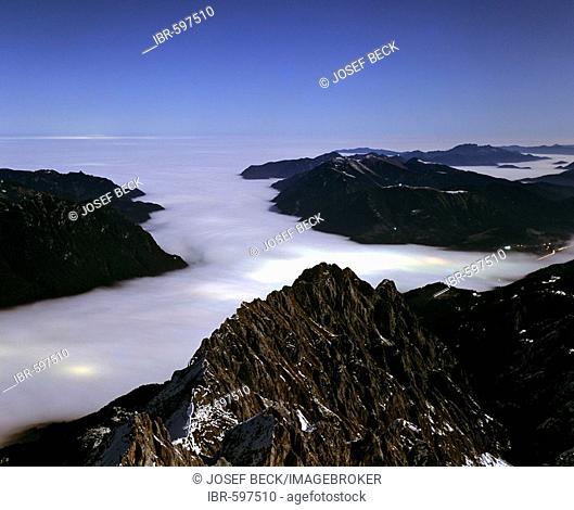 Night shot, the lights of Garmisch-Partenkirchen and a sea of fog, Zugspitze, Germany's highest mountain, Wetterstein Range, Werdenfels Region, Upper Bavaria