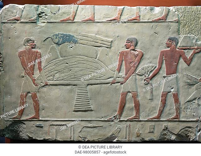 Egyptian civilization, Old Kingdom, Dynasty V. Painted limestone fragment of relief depicting offering bearers.  Paris, Musée Du Louvre