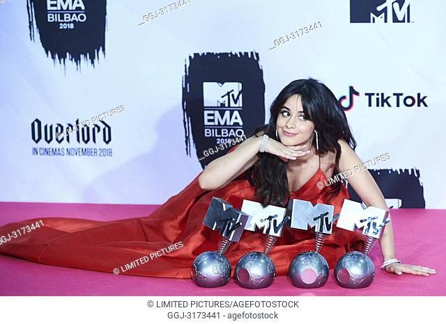 Camila Cabello poses with her four awards in the press room during the 25th MTV EMAs 2018 held at Bilbao Exhibition Centre 'BEC' on November 4, 2018 in Madrid