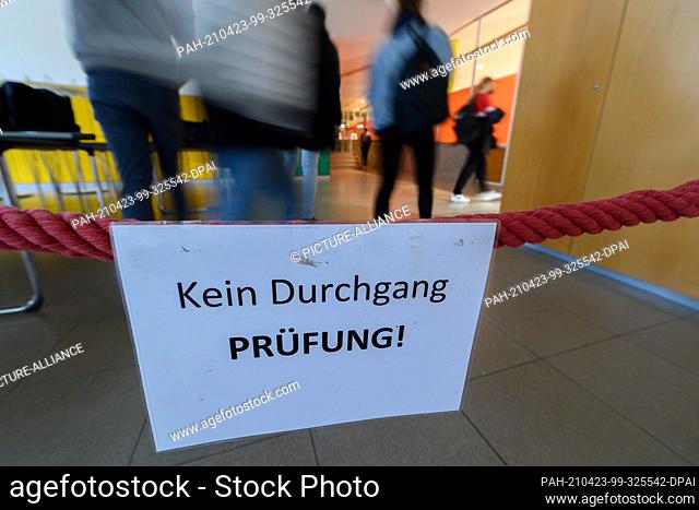 23 April 2021, Saxony, Dresden: A note ""No passage exam!"" hangs on a cord in front of the auditorium of the St.-Benno-Gymnasium before the start of Abitur...