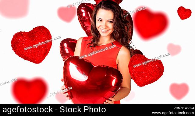 Young woman with red heart box in hand and falling hearts on white background