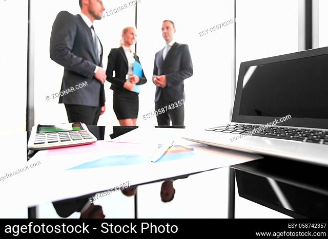 Group of people in business meeting working with documents with diagrams showing successful results