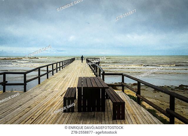 View of a lonely man in La Gola beach, Santa Pola, Alicante province, Spain