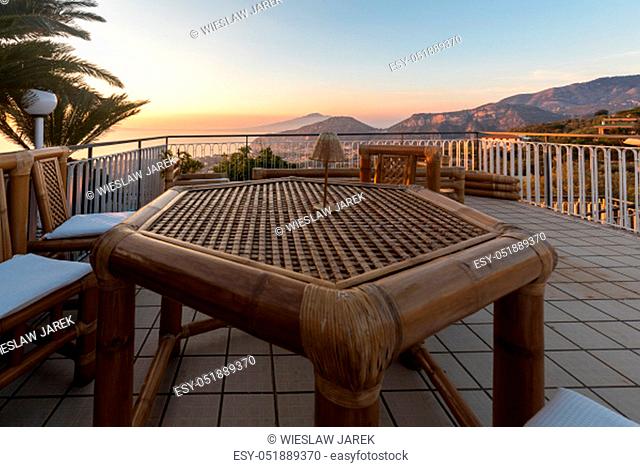 Table on the terrace overlooking the Bay of Naples and Vesuvius. Sorrento. Italy