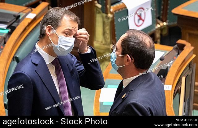 Prime Minister Alexander De Croo and Justice Minister Vincent Van Quickenborne pictured during a plenary session of the chamber at the federal parliament in...