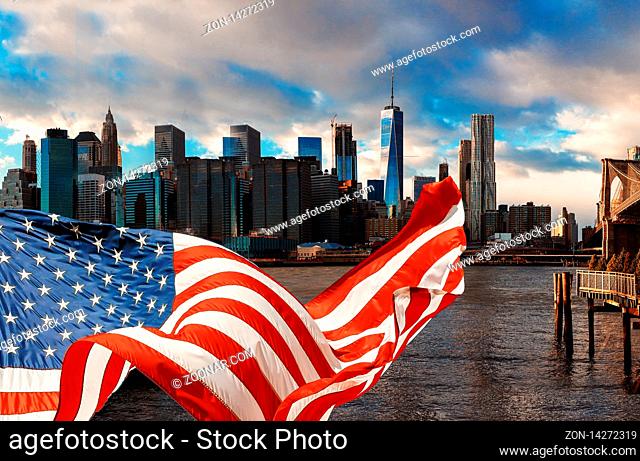American flag flying and Brooklyn Bridge in New York City Manhattan